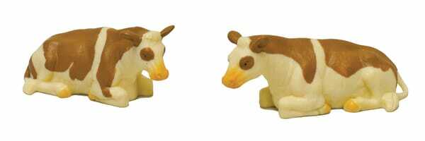 Loisirs - Jouets - 2 vaches tachetées allongées